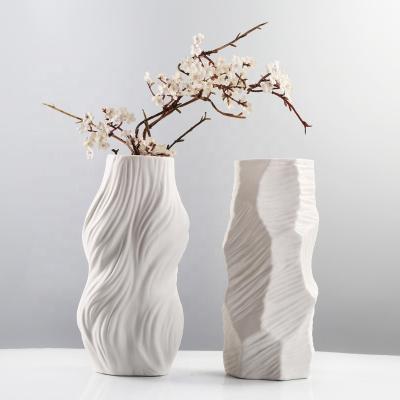 China Modern household decorative ceramic vase a large white ceramic vase with unique minimalist shape, which is used for luxury hotel decorums for sale