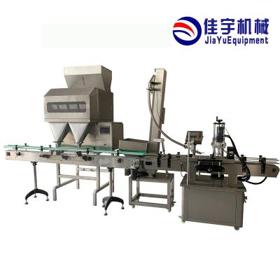 China Automatic Multi Function Sachet Nuts Sachet Vertical Food 100g Granule Packing Packing Sealing Machine for sale