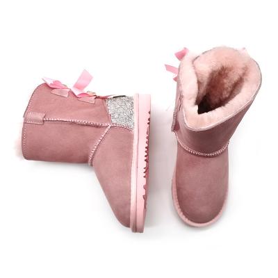 China Custom Round Cowhide Warm Suede Round Top Girls Indoor Indoor Outdoor Flat Ankle Boots Kids Snow Boots With Bows for sale