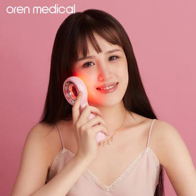 China Oren Medical Handheld Beauty Device Anti-Puffiness Photon Therapy Skin Care Innovation Anti Acne Skin Dipper Led Face Massager for sale