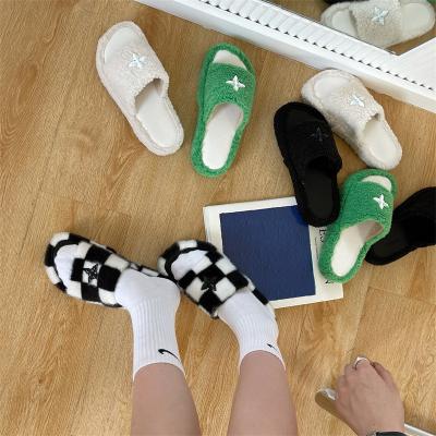 China Home slippers thick-soled shoes new fashion trend 2022 fashion cross flower sheep plush black sheep outer slippers women's wear for sale