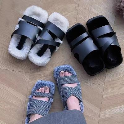 China 2022 New Fashion Trend Niche Plush Asymmetric Shoes Fashionable Comfortable Warm One Foot Pedal Outdoor Wear Slippers for sale