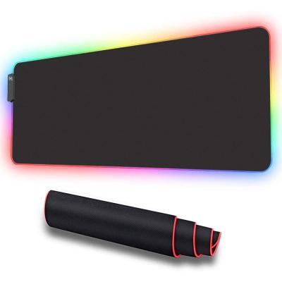 China 100% Eco-Friendly Custom Striking Glowing Logo Extended Large Visually Lighting RGB LED Gaming Mouse Pad for sale