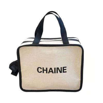 China Xiaoxiangfeng multifunctional portable storage bag simple and generous large capacity cosmetic handbag for sale