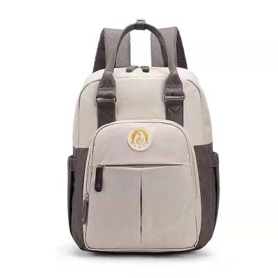 China Fashion and simplicity hot sale in 2021 color contrast backpack baby diaper bag multi function mother baby bag for sale