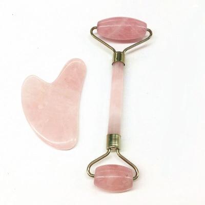 China High Quality Handheld Portable Natural Pink Stone Jade Roller Health Care Facial Massager for sale