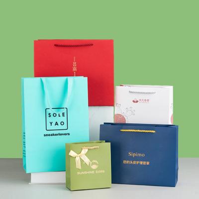 China Offset Printing Surface Handling Toowin Customized Paper Bags for Clothing Store for sale