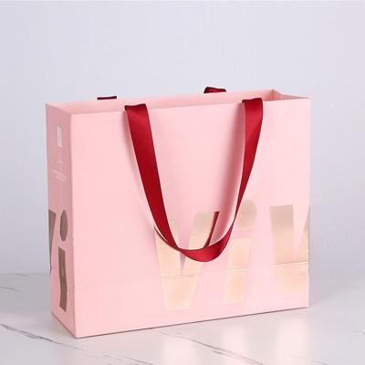 China Hand Length Handle Cardboard Bag For Boutique Clothing Jewelry Packaging From Toowin for sale