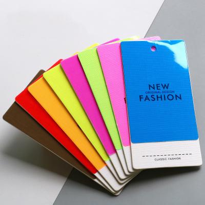 China Hot Saling Custom Tags Colorful Soft PVC Hangtags For Clothing Own Logo Double Layer Clothing Tag With Strings for sale