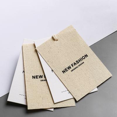 China New Design Garment Tags Cotton And Linen Canvas Clothing Paper Swing Hang Tags Customizing Logo Labels Garment Accessories for sale