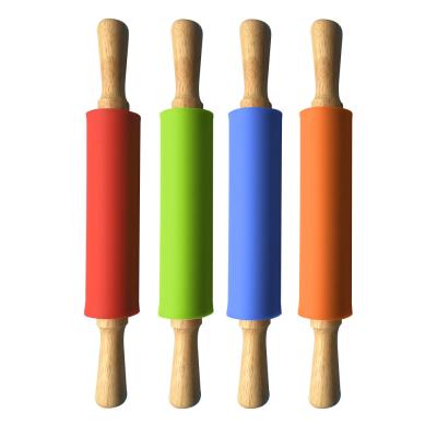 China Sustainable Food Safe Silicone Rolling Pin Non-Stick Baking Dough Roller Kitchen Tools With Wooden Handle for sale