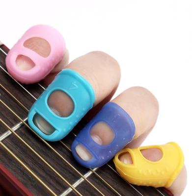 China Fashoin Finger Thumb Picks Fingertip Protector / Silicone Pick Set for sale