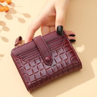 China 2023 New Water Resistant Women's Short Style Crocodile Retro Simple Clip Wallet Clips High Quality Waterproof PU Bag Hot-selling for sale