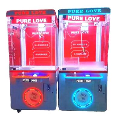 China SDK Wholesale Mini Coin Operated Electronic Claw Machine Toy Vending Catch The Doll Game Machine for sale