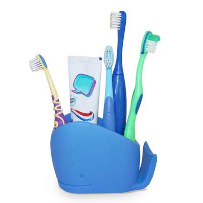 China Eco Viable Silicone Cute Bathroom Accessories Blue Whale Kids Toothpaste Toothbrush Holder for sale