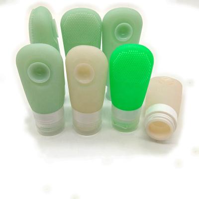 China Hot Selling Convenient Can Bottle Cosmetic Adsorbe Silicone Skin Care Lotion Silicone Bottle Slit Squeeze Bottle Travel Portable Silicone for sale