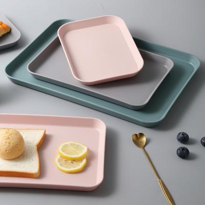 China Minimalist Plastic Tea Fruit Food Storage Trays Plastic Rectangular Dish Tray Unit with 3 Sizes Stacked Trays for Kitchen Pure Color for sale