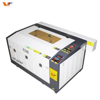 China CNC Machine 50w 60w laser CO2 cutterfabric cutting machine cricut explore air 2 machine for sale