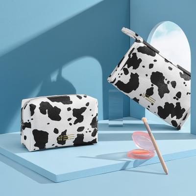 China New PU Square Bag INS Wind Cow Model Travel Bag Cosmetic Milk Cosmetic Portable Model Storage Bag for sale