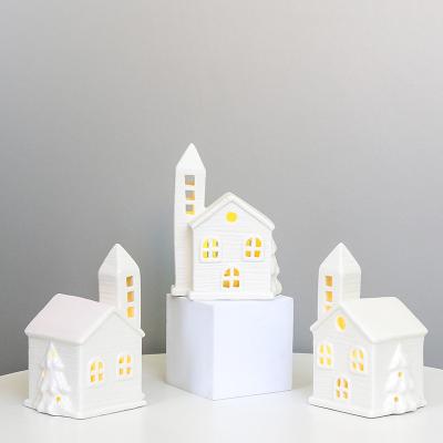 China Decorative Ceramic Christmas Village Houses With Cutout Windows For A Beautiful Glow Led Light The Perfect Gift For Holidays for sale