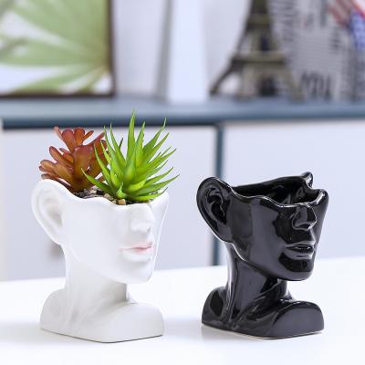 China Modern cute face black and white flower pots for men and women ceramic vase flower pots table ornaments decoration home garden for sale