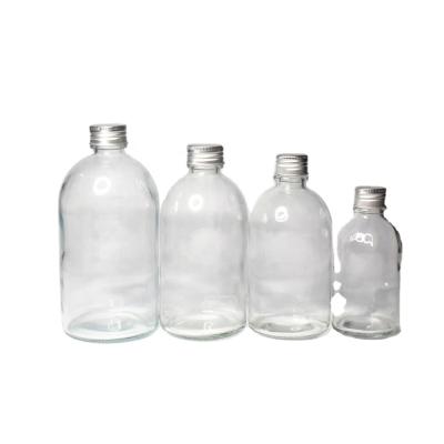 China Beverage 150ml, 250ml, 350ml, 500ml Aluminum Clear Round Cap Wholesale Glass Beverage Bottle Cold Drinking for sale