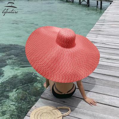 China Environmentally Friendly Women Large Bowknot Straw Hat Floppy Foldable Roll Up Hat Sun UV Protection Beach Hat for sale