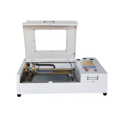 China Laser Engraving JIN ZHI YIN Laser Power 50W China CNC CO2 Laser Engraving And Cutting Machine With M2 Control System 400*400mm Acrylic Plywood for sale