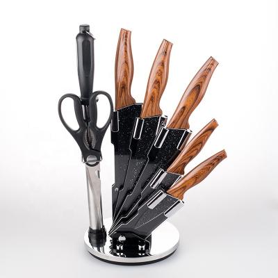 China Sustainable Premium Stainless Steel Kitchen Knife Set With Revolving Acrylic Holder - 8 Piece Set for sale