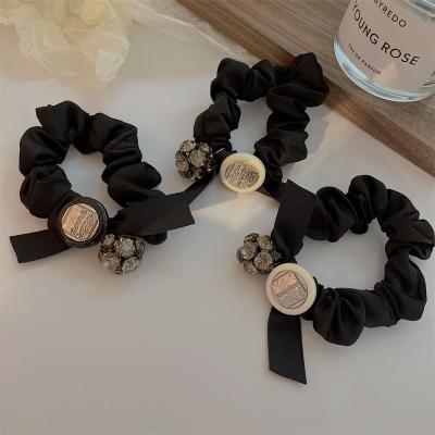 China Black Faux Pearl Rope Hair Scrunchies Hair Tie Elastic Band Girls Headwear Wholesale Rubber Bands Headband Elastics With Pearls for sale