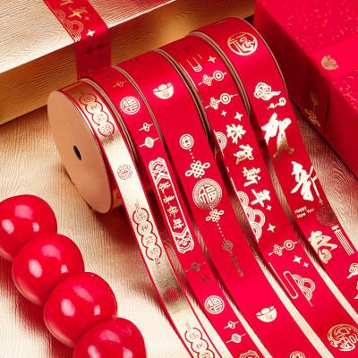 China LaRibbons New Year Spring Festival Spring Festival Gold Print Satin Ribbon Viable Chinese Red Ribbon for sale