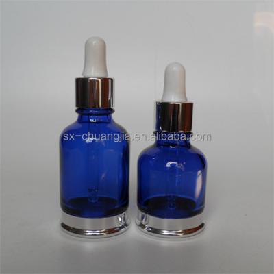 China Cosmetic Packaging Cobalt Blue Blue Bottle And Silver Glass Bottom Jar for sale