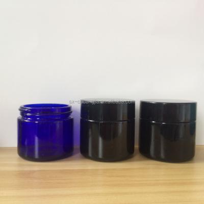 China 60ml 2oz Cosmetic Cosmetic Amber Blue Black Cream Glass Jar With Bakelite Cap for sale