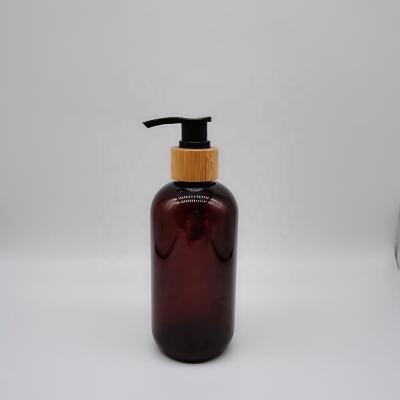 China Amber / Customized Cosmetic Bottle Shampoo Color Bottle Cosmetic Packaging Products With Bamboo Pump for sale