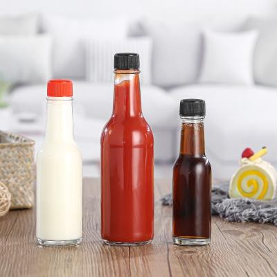 China Gagdets 2023 3oz 5oz 8oz 150ml 250ml Clear Clear Glass Chili Salad Ketchup Hot Sauce Kitchen Dazed Bottle With Black Cap for sale