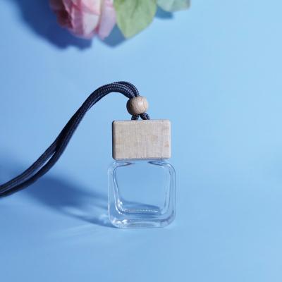 China Wholesale 10ml Cosmetic Clear Car Diffuser Glass Bottle Car Hanging Empty Perfume Bottle With Wooden Cap for sale