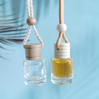 China Fragrance Around 6-8ml Diffuser Car Perfume Bottle Car Essential Oil Glass Bottle Hanging Car Air Freshener With Wooden Lid for sale