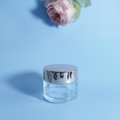 China New Design Cosmetic Clear Frosted 100g Empty Body Care Cosmetic Glass Cream Jar For Cosmetic Packaging for sale