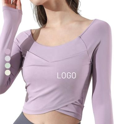 China Breathable Long Sleeve Yoga Tops Gym Clothes Women Fitness Wear Sexy Unique Slim Fit Wrap Shirts Workout Cross Crop Tops for sale