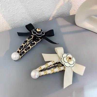 China Girl Hair Decoration Designer Camellia Hair Clips Famous Brand Collection Hair Accessories Flower Hair Clips Hairpins Girls Fashion Headwear for sale