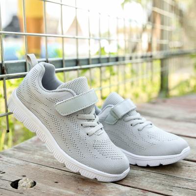 China Kids Round Lightweight Breathable Fly Sneakers Walking Shoes Kids Sports Knitting Simple Casual Shoes for sale