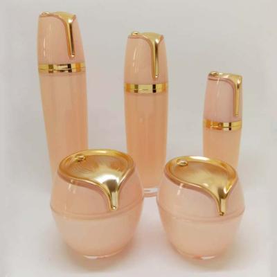 China Factory direct sales orange cosmetic lotion bottle bottle shape acrylic special skin cream jar for sale