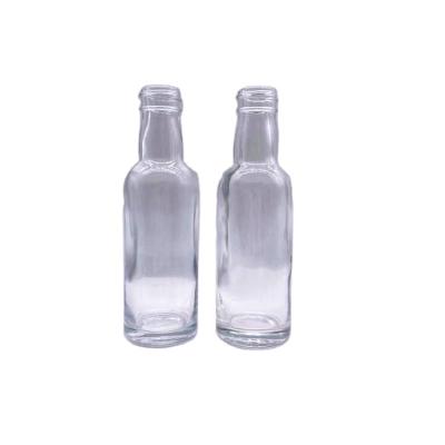 China 50ml Mini Small Beverage Alcohol Juice Drinks Glass Wine Liquor Glass Bottle With Screw Cap for sale