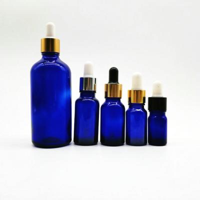 China Personal Care Production Cobalt Blue Essential Oil Bottle With Aluminum Caps Silver Gold Dropper for sale