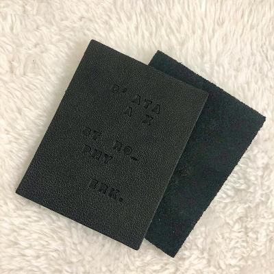 China Recyled Black Rectangle Leather Label With Debossed Craft Logo With High Quality Best Price Garment Leather Hot Stamping Leather Patch for sale