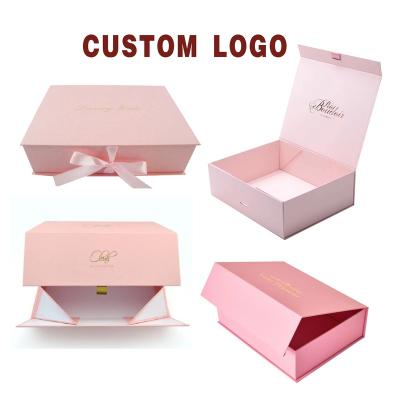 China Recyclable Luxury Folding Cardboard Flat Pack Box Pink Ribbon Paper Closures Book Shaped Foldable Package for sale