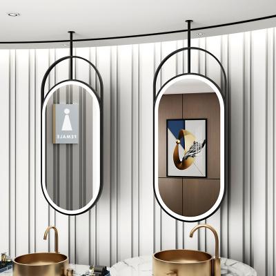 China EUROPEAN Hollow-out elliptical mirror ceiling hanging mirror hotel bathroom mirror with lights for sale