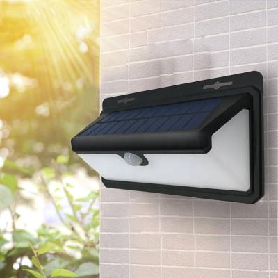 China Solar Powered Garden Motion Sensor Wall Lights Outdoor Waterproof Led Garden Lamp 100Led Solar Yard Wall Lights On The Wall for sale