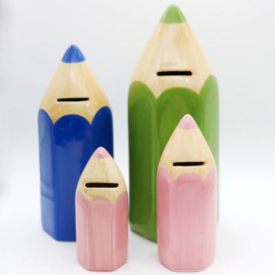 China Eco - Friendly Decorative Hand Craft Crayon Shaped Ceramic Piggy Bank For Kids for sale