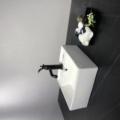 China Modern Luxury Wall Hung Mounted Sink Ceramic Hand Wash Basin for sale